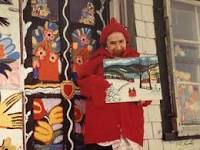 Maud Lewis in the entrance to her painted home